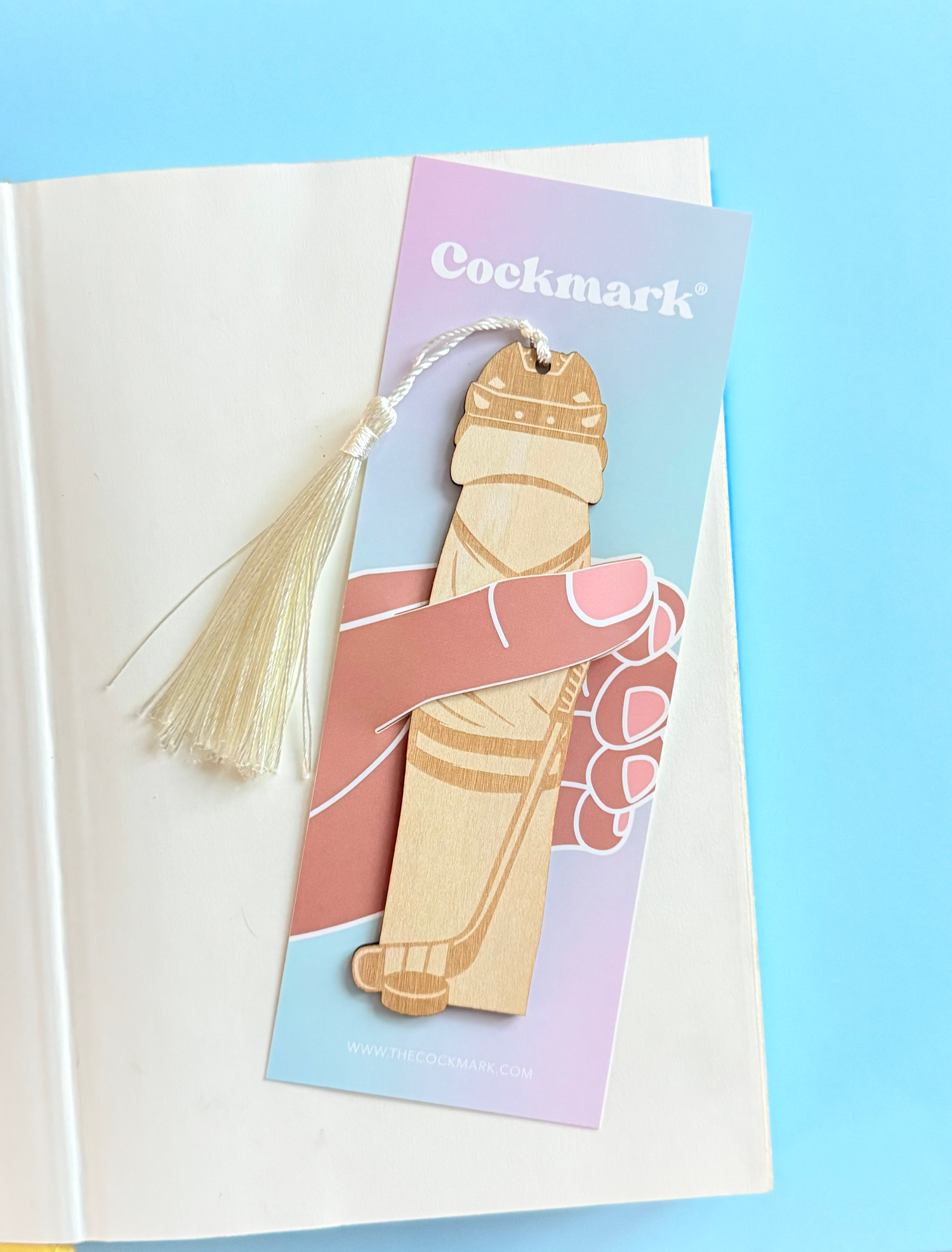 Bookmark with tassel on a pastel background