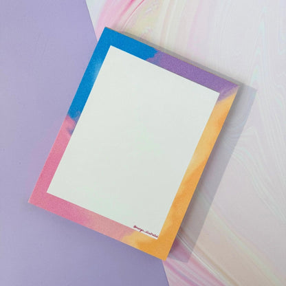 Afterglow notepad detail — pink and orange golden hour gradient edge by indie artist MangoIllustrated