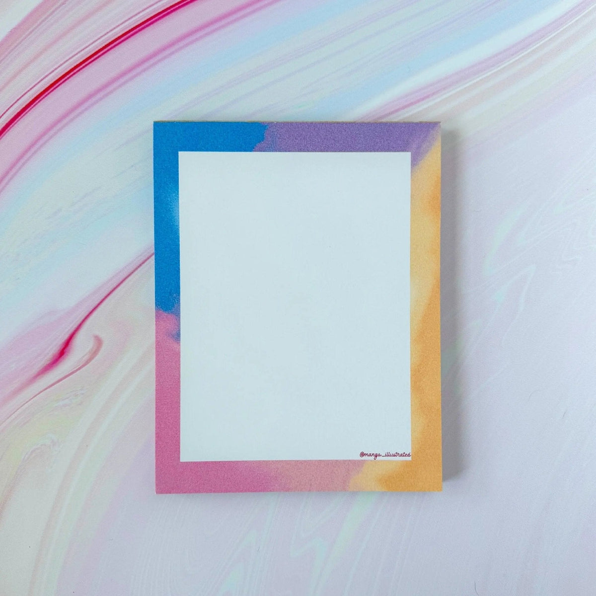 Afterglow notepad — pastel gradient note pad shown in a cellophane sleeve by indie artist MangoIllustrated