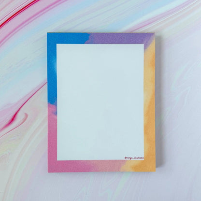 Afterglow notepad flat lay — cotton candy sky gradient desk notepad by indie artist MangoIllustrated