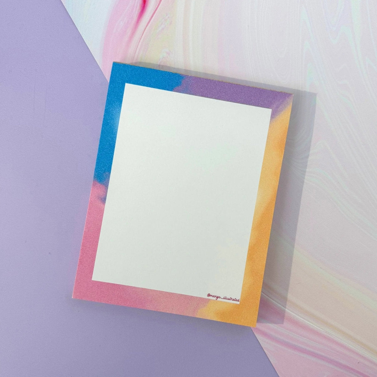 Afterglow notepad flat lay — 4 x 5.5 inch gummed note pad styled on a desk by indie artist MangoIllustrated