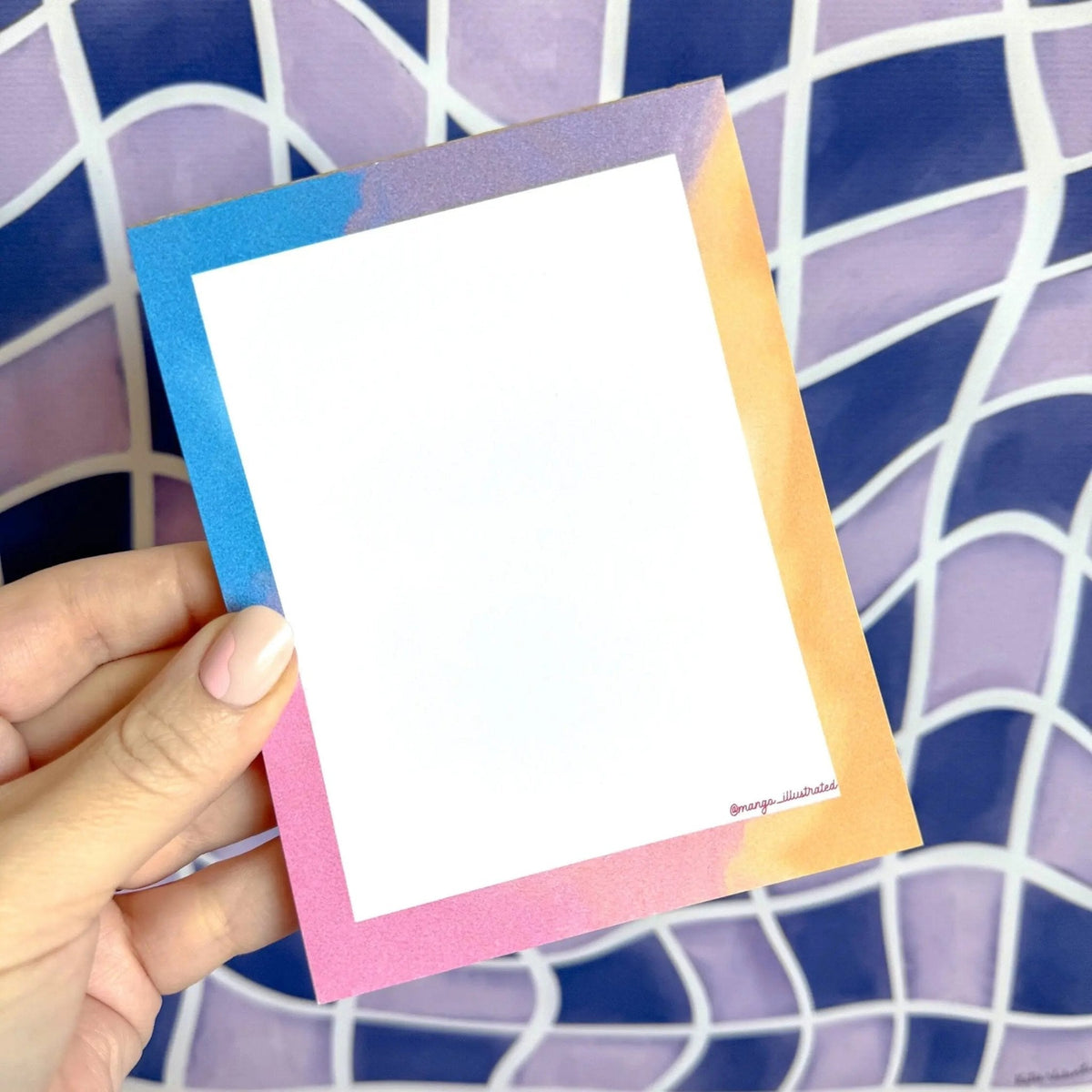 Afterglow notepad flat lay — pastel illustrated stationery gift styled on a desk by indie artist MangoIllustrated