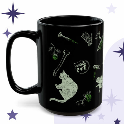 Toxic green goth mug in black ceramic with acid green Victorian engraving of a black cat, loose bones, a skull, and a rose