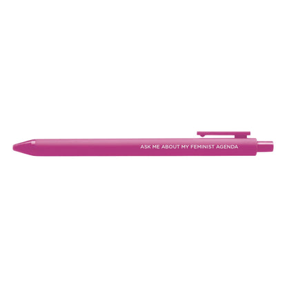 Ask me about my feminist agenda pen flat lay — pink feminist gel pen with black ink by indie artist MangoIllustrated