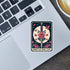 Sticker with a sword and roses design on a laptop