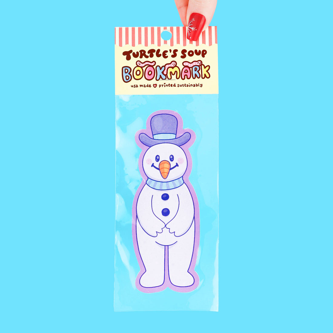 Bookmark with snowman design in clear packaging against a blue background