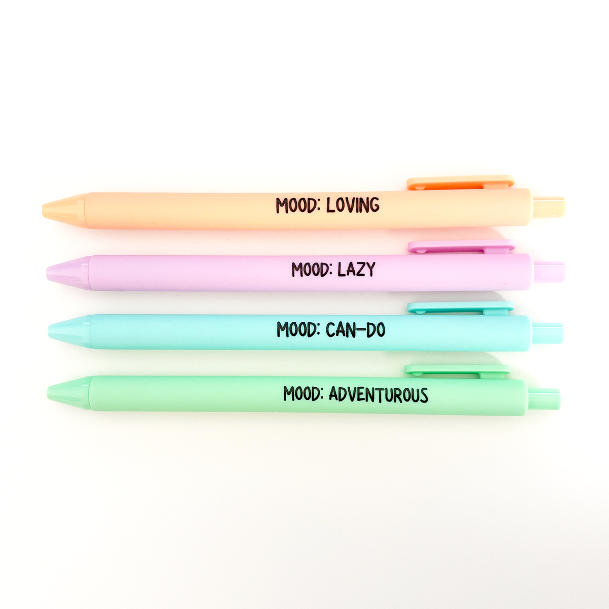 Four pastel gel pens stacked vertically on a white background, each with a different color and printed with a black text label: &