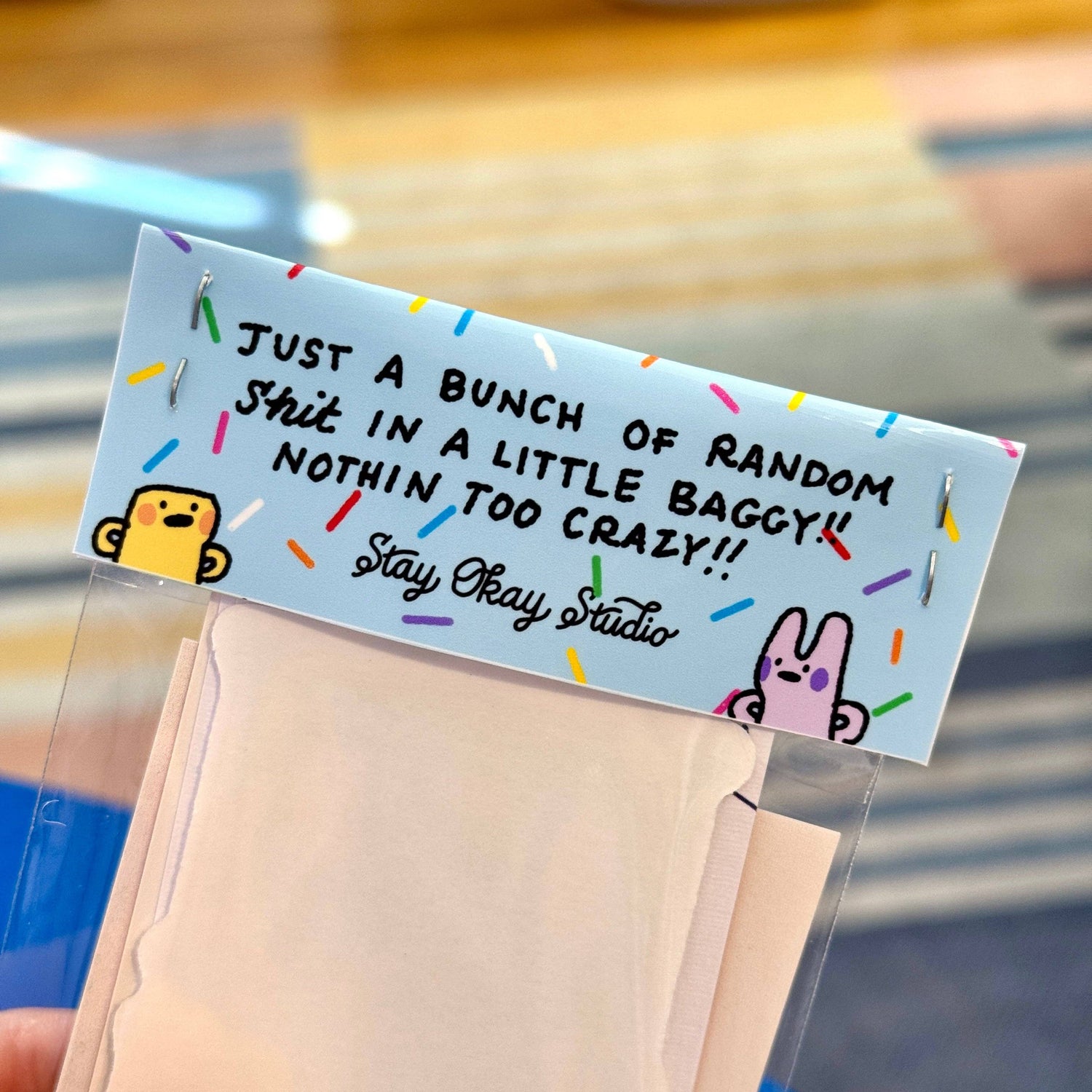 Note with text and cartoon characters on a clear bag
