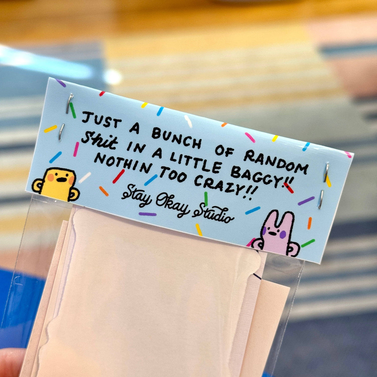 Note with text and cartoon characters on a clear bag