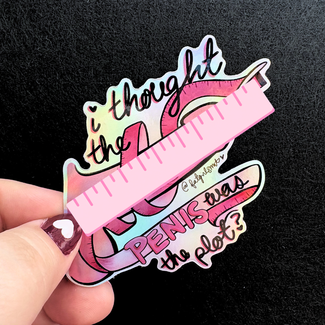 Holographic sticker with text held by a hand against a black background