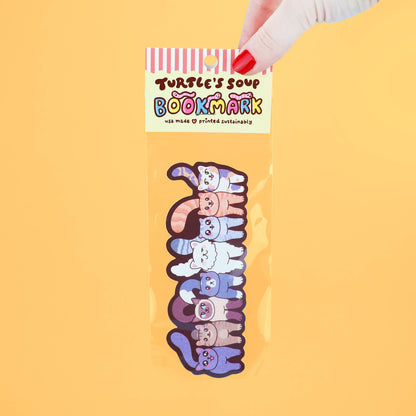 Colorful bookmark with cartoon characters in packaging on a yellow background