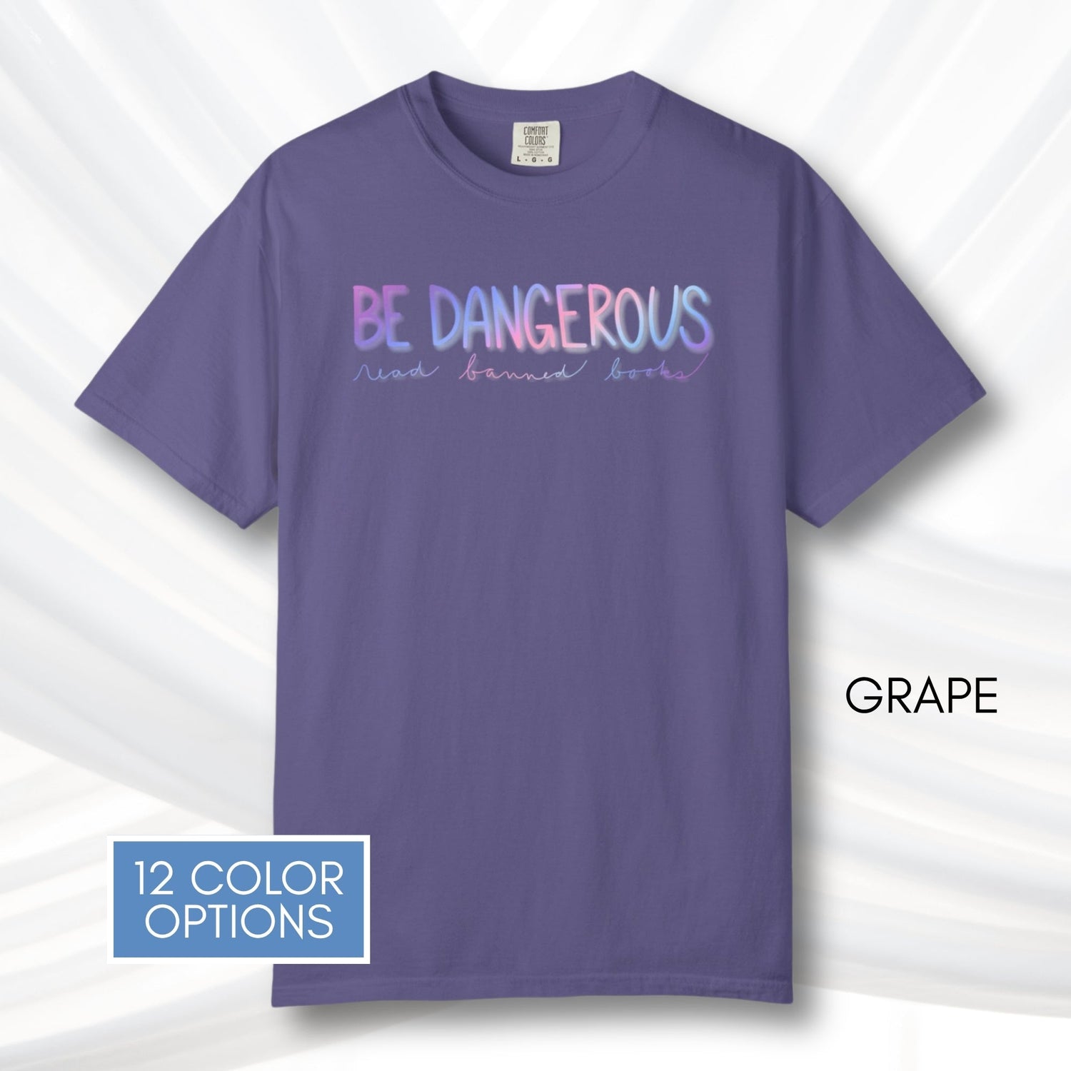 be-dangerous-read-banned-books-unisex-tshirt-colorful-literary-graphic-tee-bookish-apparel-comfort-colors-grape