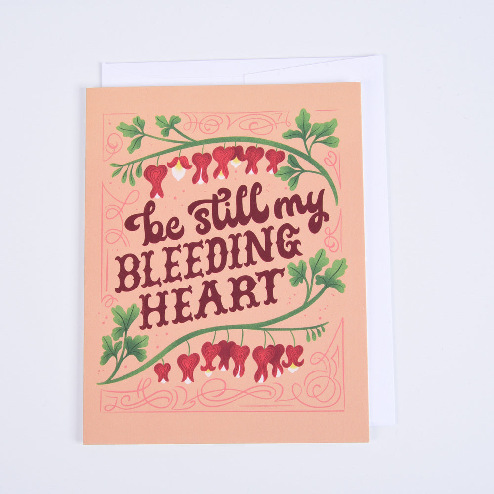 A folded greeting card with a floral design and the phrase &
