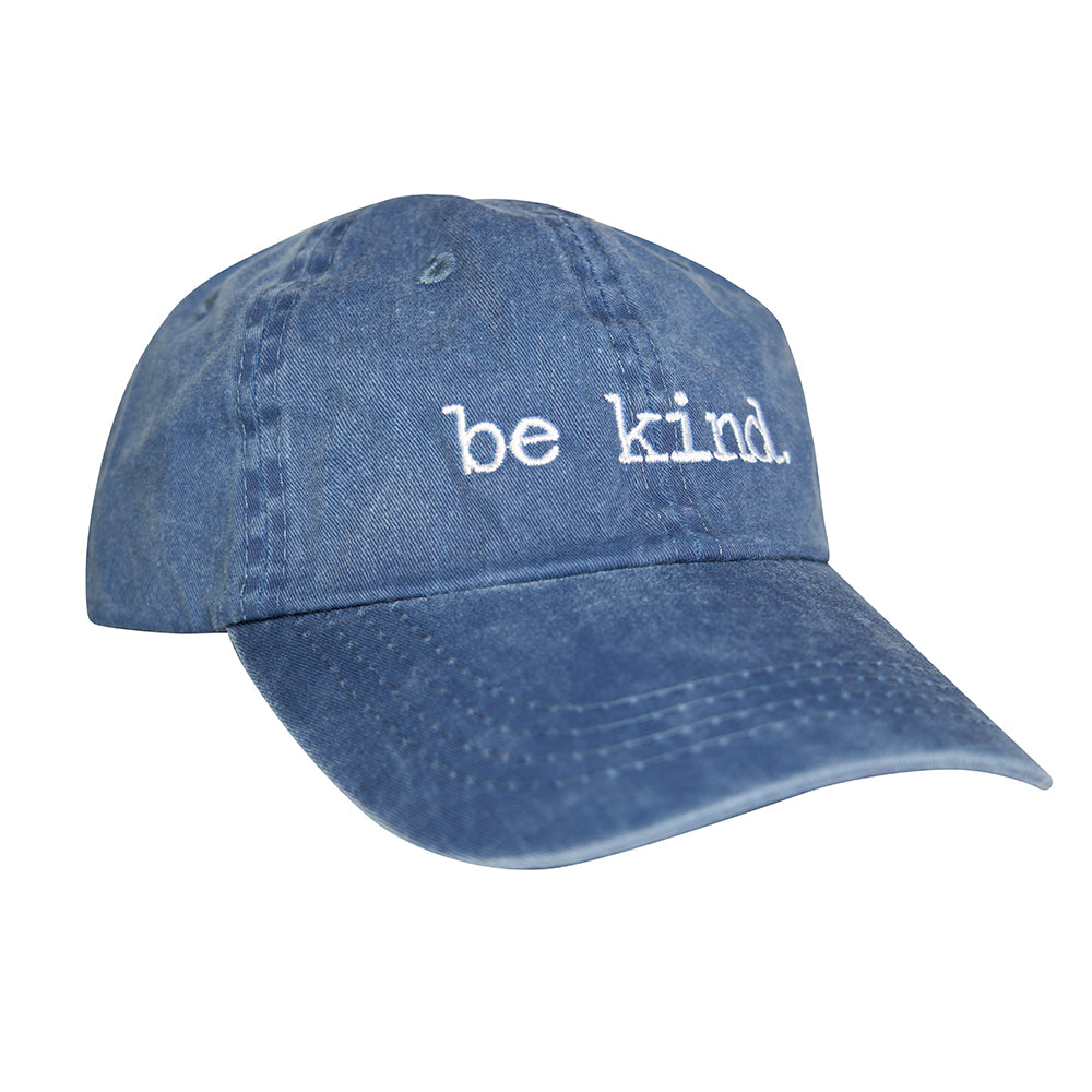 Worn blue cotton dad hat with white "be kind." embroidery, featuring a soft, distressed finish and curved brim