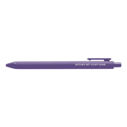 Bitches get stuff done pen flat lay — purple feminist gel pen with black ink by indie artist MangoIllustrated