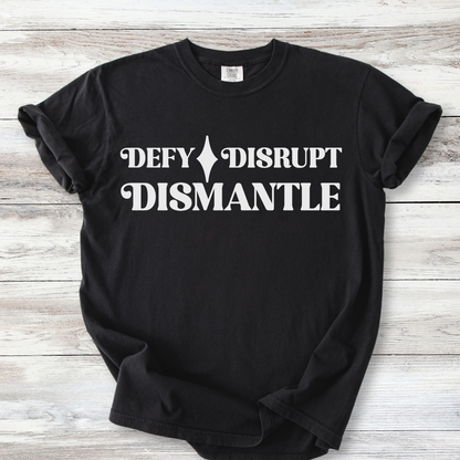 The words DEFY DISRUPT DISMANTLE.  DEFY AND DISRUPT are on the top line with a star between them.  DISMANTLE is the bottom line, lining up vertically with the top line. Lettering is a stylized retro style font.  