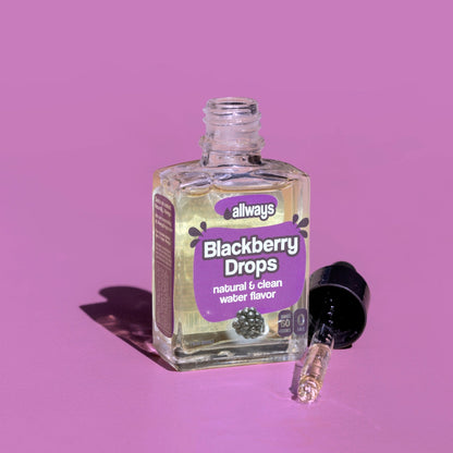 allways blackberry drops in glass bottle with dropper laying next to it in front of a purple background