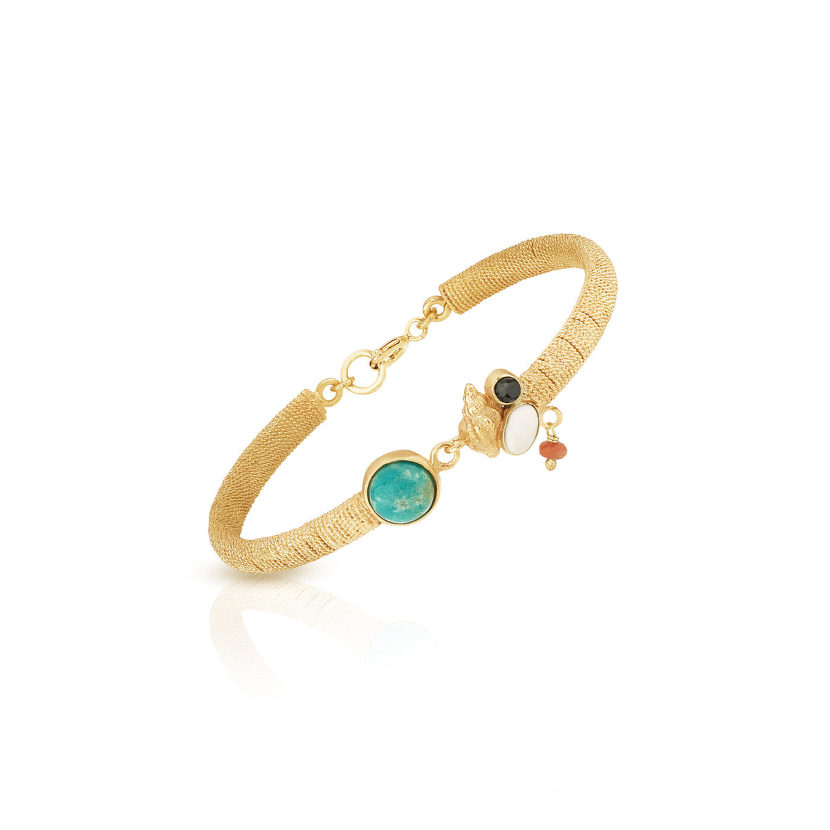 ethically handmade gold filigree cuff bracelet with assorted stones laid organically and a conch shell, luxury fair trade jewelry in chicago 