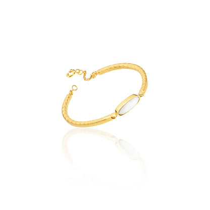 Ethically handmade online jewelry: gold crosshatched bangle with bezel set mother of pearl and clasp, luxury bracelet  jewelry in chicago 