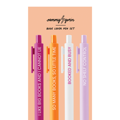 Set of four pens with motivational phrases on a peach background, featuring the brand &