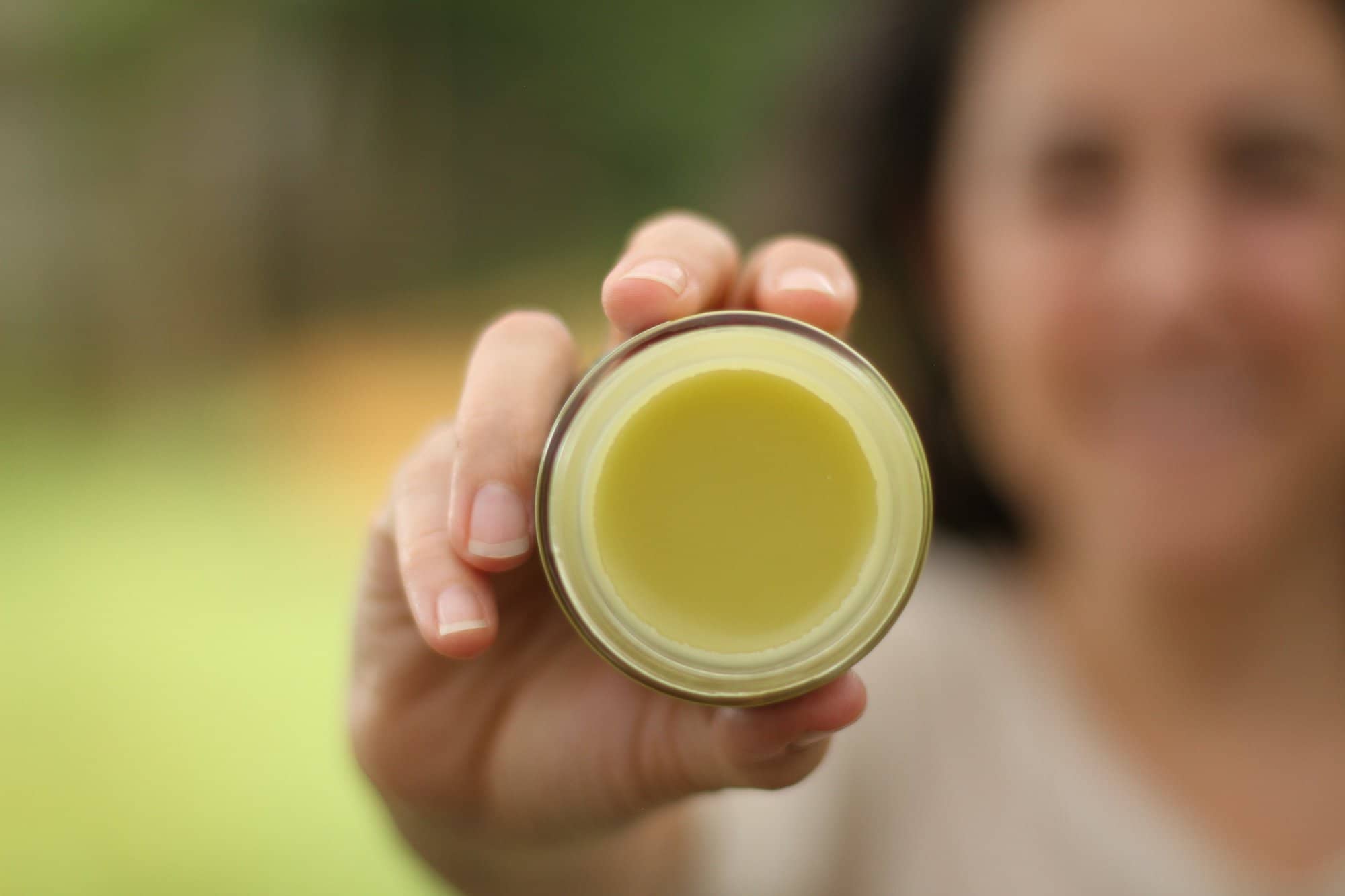 Calendula Salve Lifestyle Outdoor Texture Ora 4oz Jar