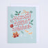 A folded greeting card with a candy cane design and &
