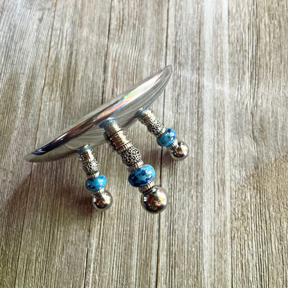 Elegant Blue Beaded Stainless Steel Candle Holder with Silver Dish - Perfect Romantic Gift displayed elegantly against a light background.