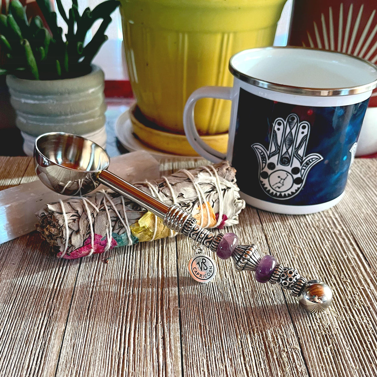 An enchanting Astro Bowl Spoon showcasing a zodiac charm and stone handle, perfect for astrology-focused tea drinkers.