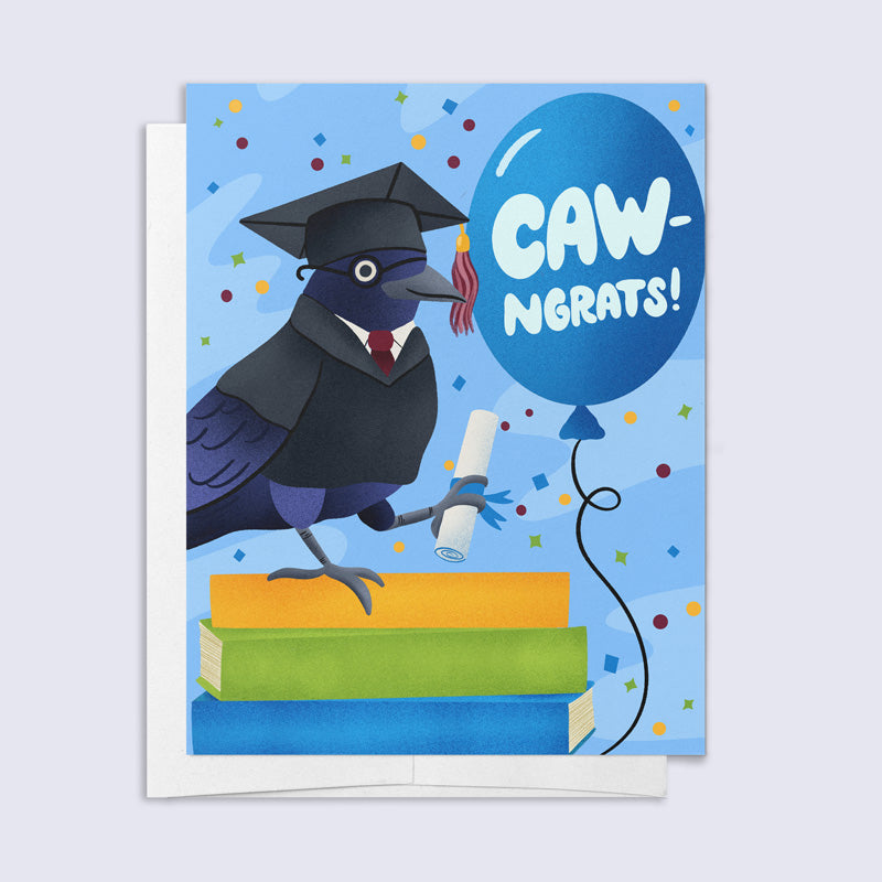 Graduation card with a cartoon crow in a cap and gown, holding a diploma, and a balloon saying &