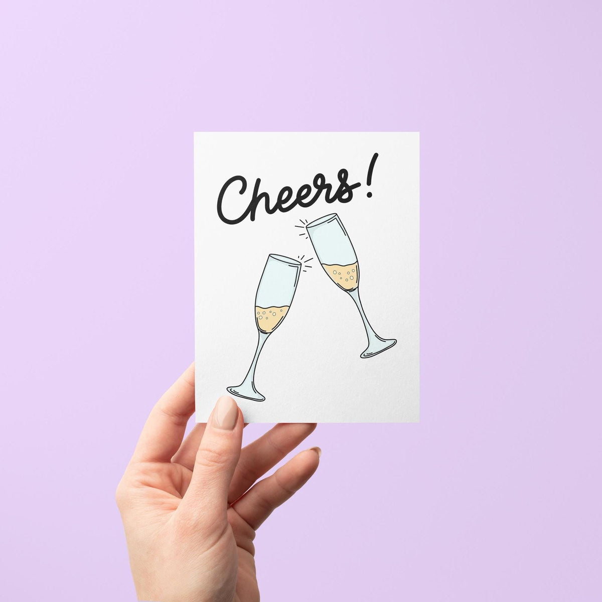 Cheers champagne card flat lay — illustrated congratulations card for a new job or engagement by indie artist MangoIllustrated
