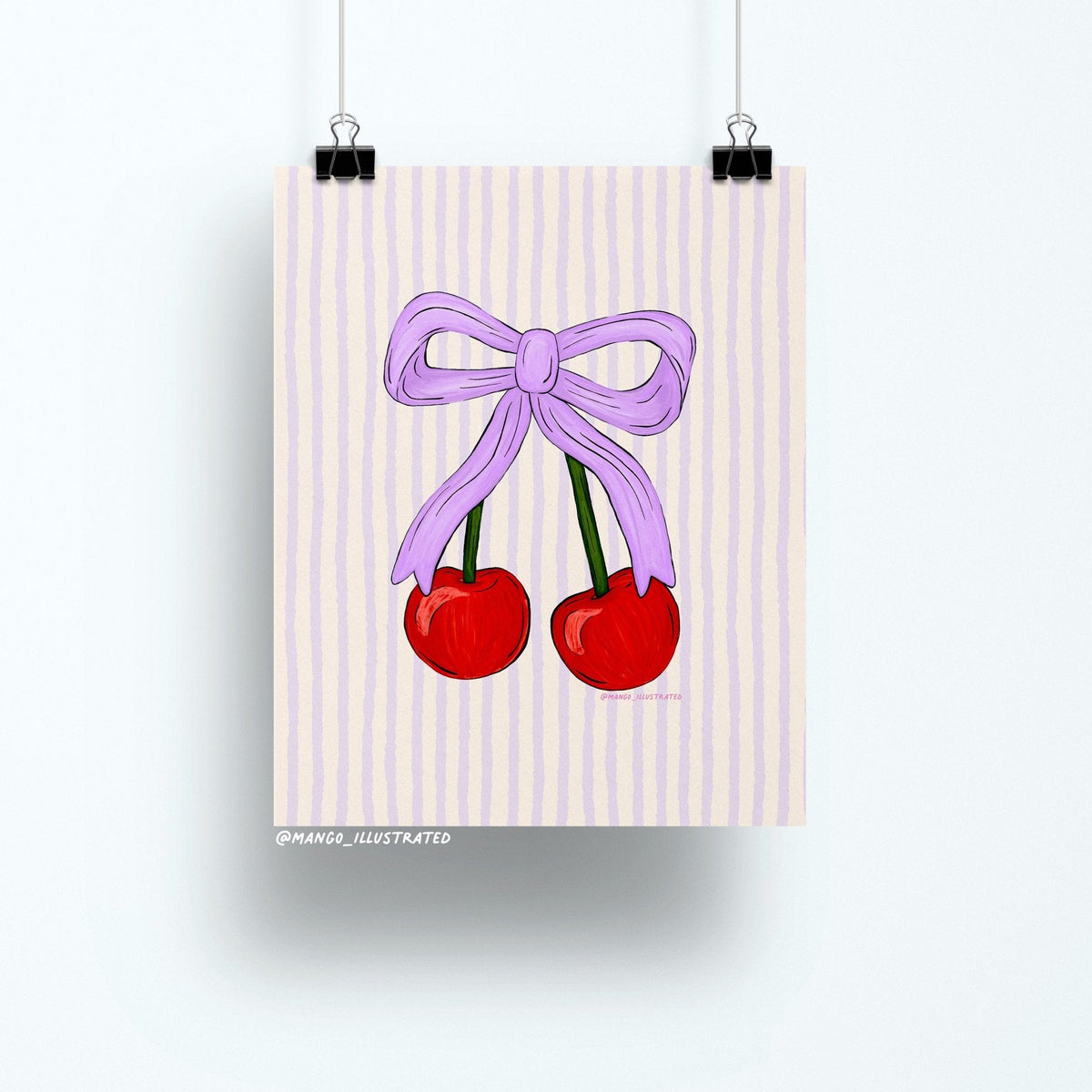 Cherries art print — two red cherries tied with a lavender bow on a pastel striped background, 8 x 10 in, by MangoIllustrated
