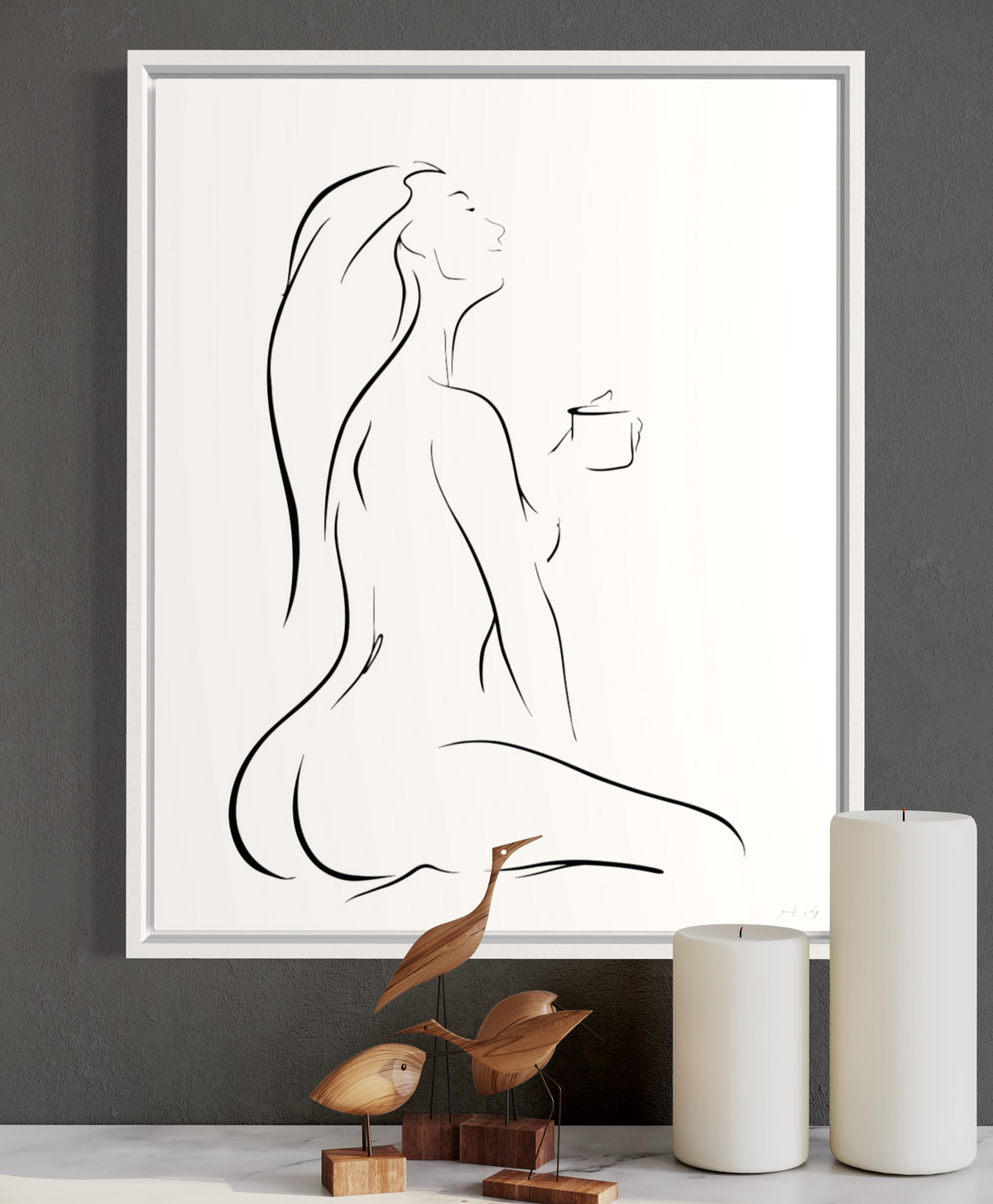 Black and white elegant line art illustration of a sensual woman enjoying her first cup of coffee, head tilted back, in a peaceful pose; framed in a white frame on a dark gray wall.