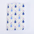 small pocket notebook with a pattern of blue vases and purple flowers on a sage green background