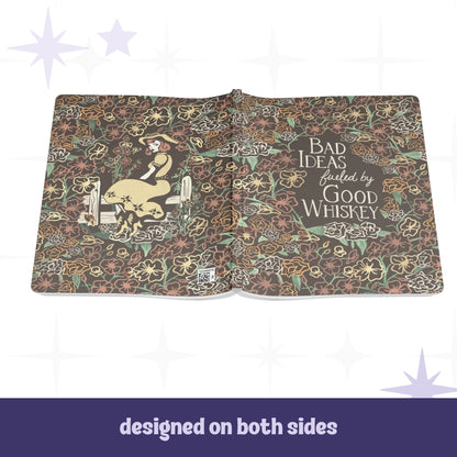 Cowgirl floral notebook open flat showing full wrap design with pinup illustration on back cover and hand-lettered text on front cover