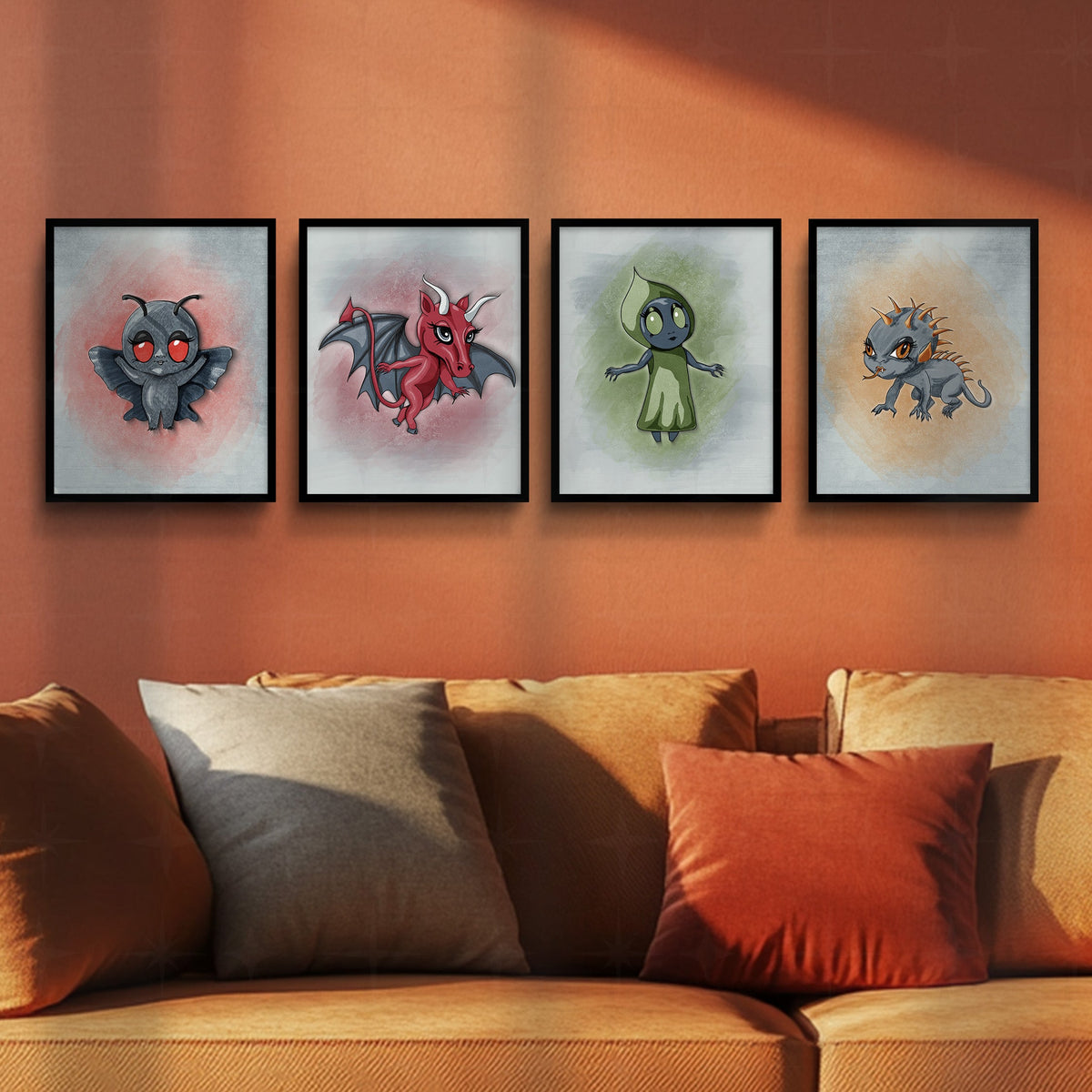Creepy cute cryptid art print set of 4 in black frames hung in a horizontal row above a burnt orange sofa with gray and rust pillows.
