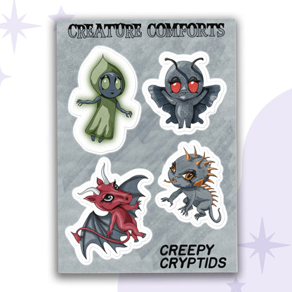 Cryptid sticker sheet with four chibi characters, the Flatwoods Monster, Mothman, the Jersey Devil, and the Chupacabra, on a gray backing card
