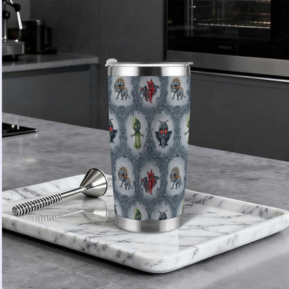 Cryptid tumbler on a marble tray in a modern dark kitchen beside a cocktail muddler