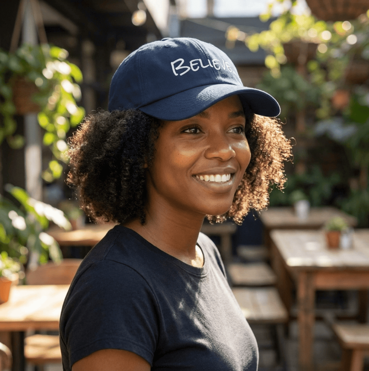 Woman wearing a custom embroidered navy blue dad hat