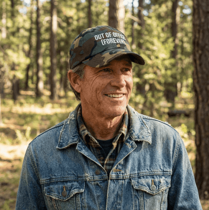 Man wearing a custom embroidered camouflage dad hat outdoors