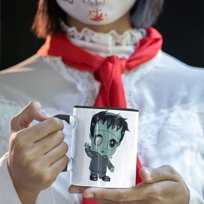 Person in Halloween costume holding the cute Frankenstein coffee mug with a chibi green monster