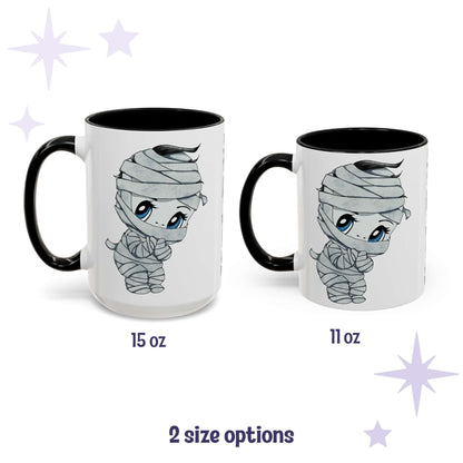 Chibi mummy monster mug shown in 15 oz and 11 oz, white ceramic with black interior and handle