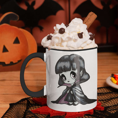 Vampire chibi mug with whipped cream and cinnamon on a Halloween table with pumpkin and bats