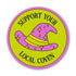 A circular sticker or badge design with a bright lime green background, pink border, and a pink wizard hat with yellow stars and stripes. The text reads &