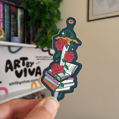 Decorative sticker with roses and books held by a hand, with &