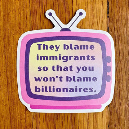 A die-cut sticker shaped like a retro television with the text &