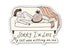 Sticker with a cartoon of a person lying on a couch with a cat sitting on them, and text &