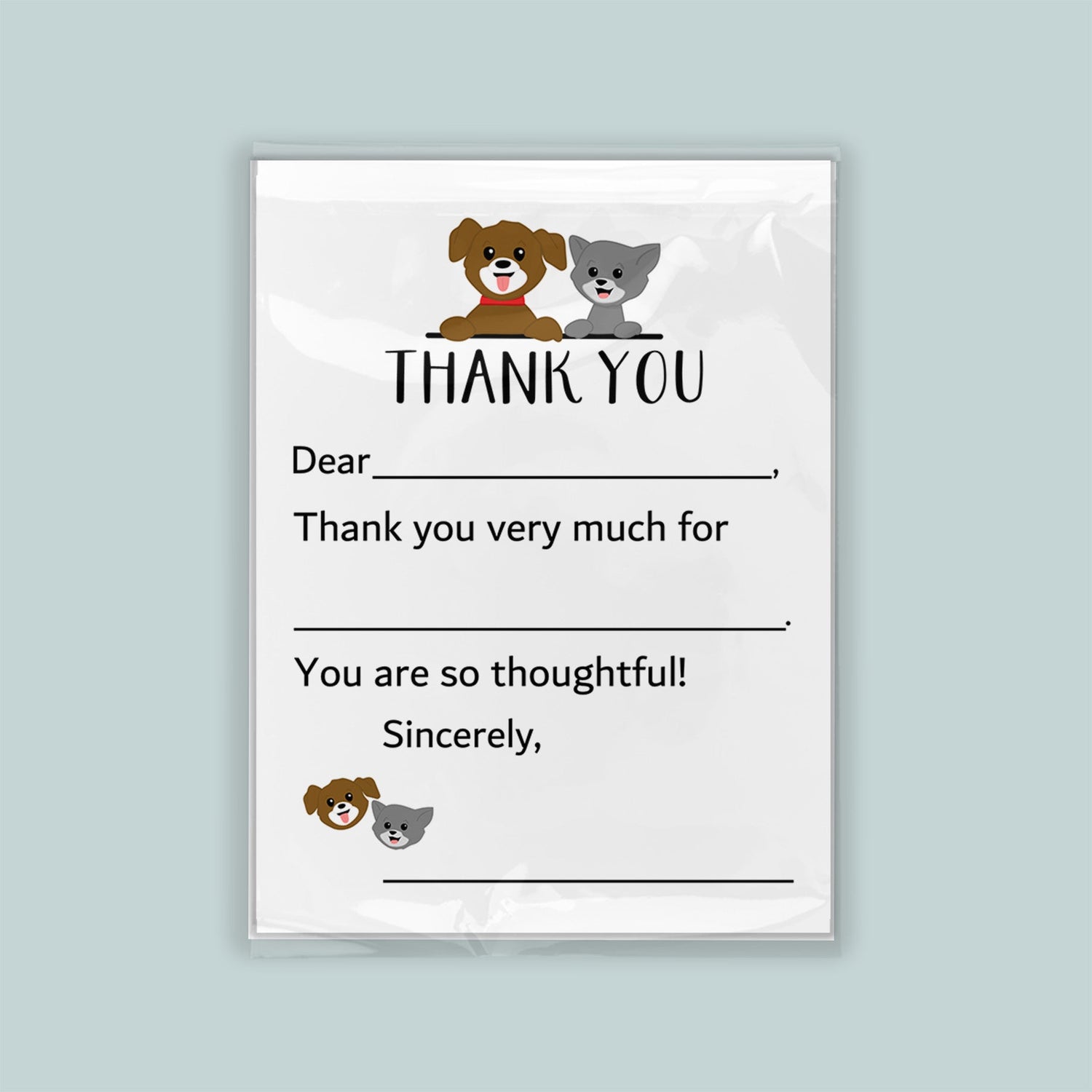 The image is a white thank you card with a cartoon dog and cat illustration. The card has a blank space for a recipient&