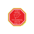 A red octagonal sticker with a yellow border and white text that reads, &