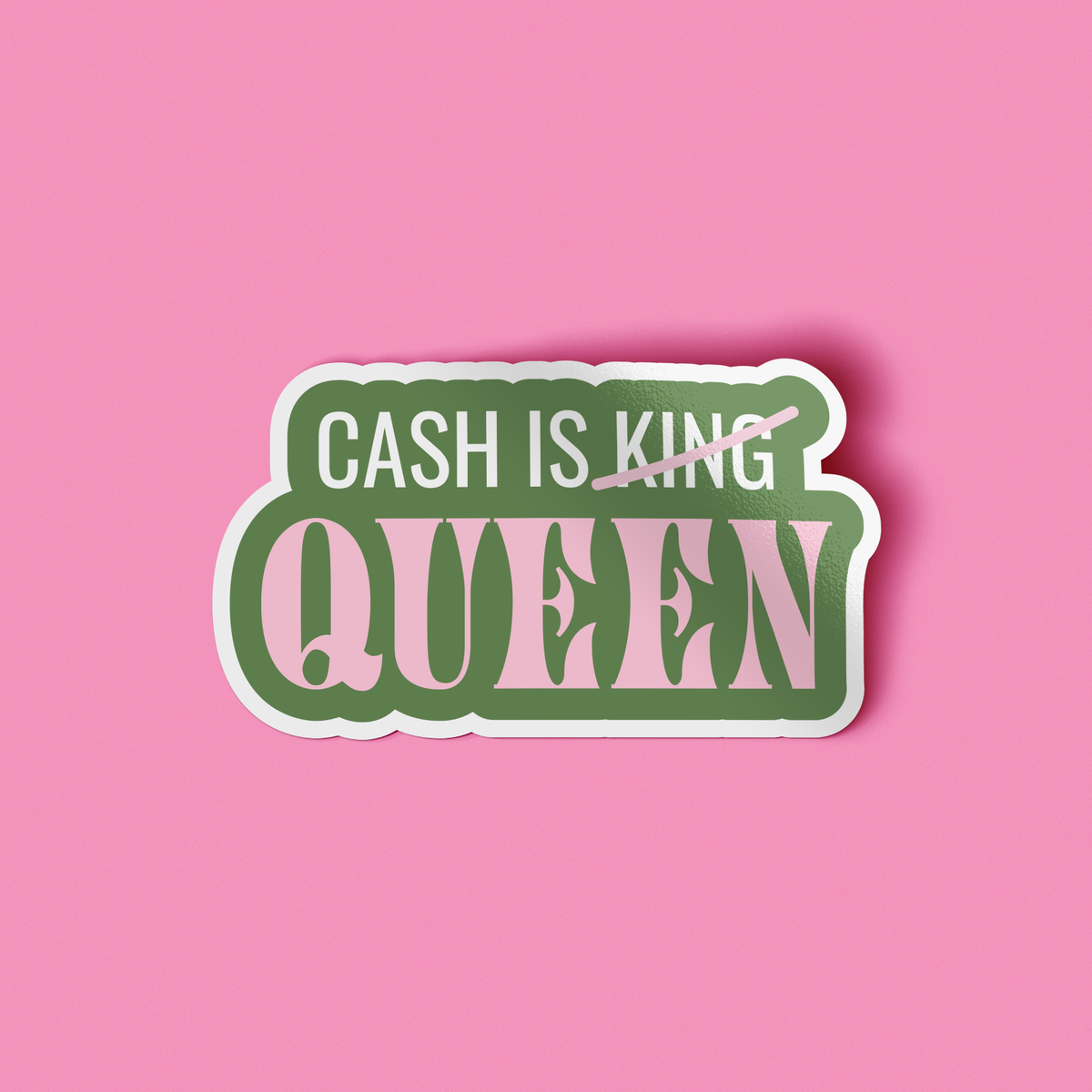 A die-cut sticker with the text &