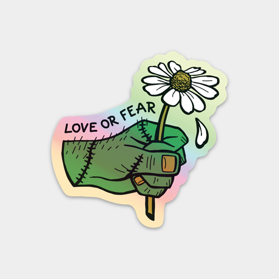 A die-cut sticker featuring a stitched green hand holding a white daisy with the text &